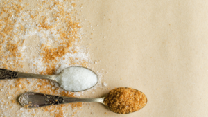 Teaspoons with brown and white sugar in them