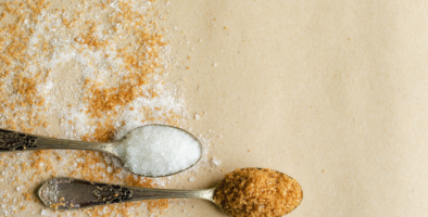 Teaspoons with brown and white sugar in them