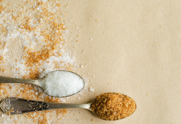 Teaspoons with brown and white sugar in them