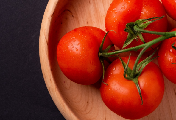 Tomatoes in a wooden bowl