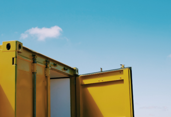 The top of a bright yellow shipping container