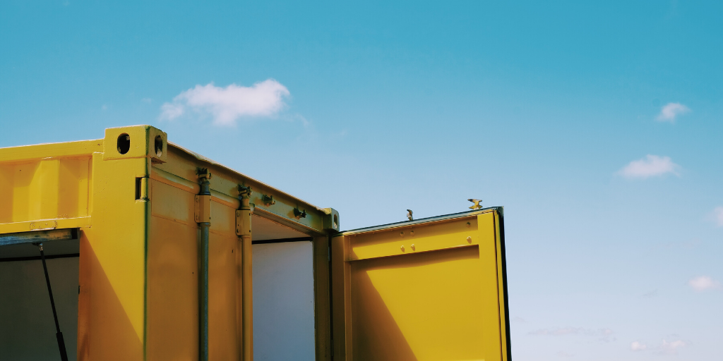 The top of a bright yellow shipping container
