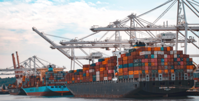 A container ship stacked high with coloured containers