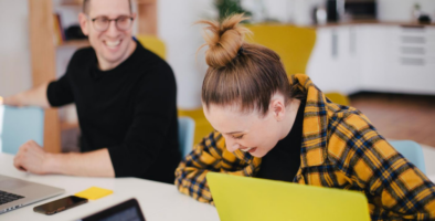 Students laughing while studying together