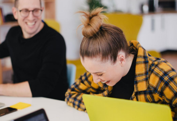 Students laughing while studying together