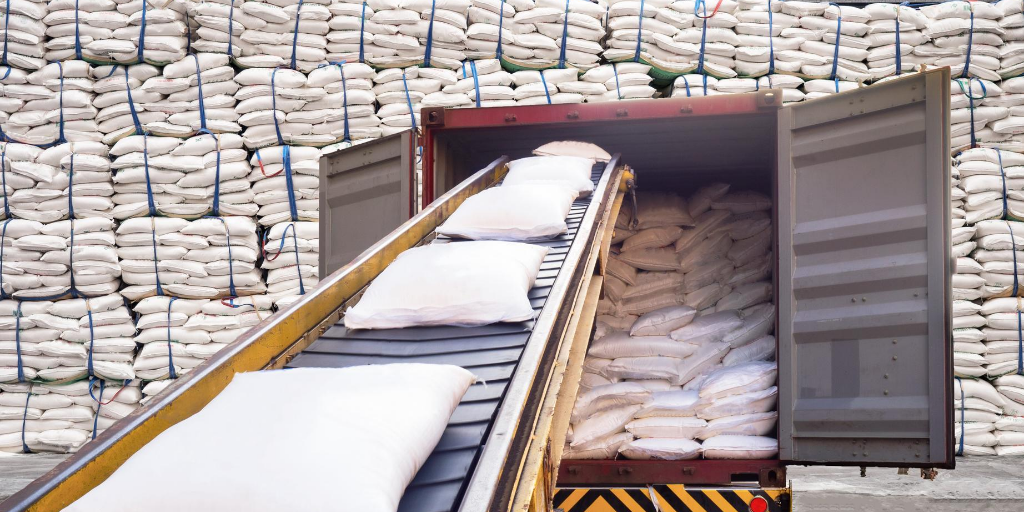 refined sugar being loaded onto a truck