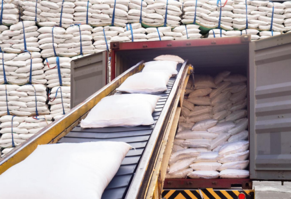 refined sugar being loaded onto a truck