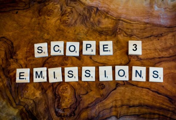 scrabble squares spell out 'scope 3 emissions' on a wooden background